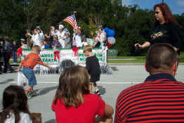 Alex scrambling for the candy being thrown out