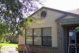 "Before".  We were amazed at how much paint came off when we pressure washed.  Look to the left of the window.  