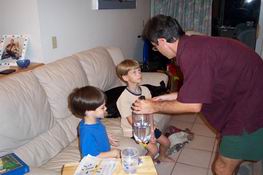 and then demonstrating how liquid can take on the shape of its container.