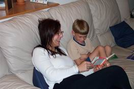 Alex was reading his bedtime story to Kat