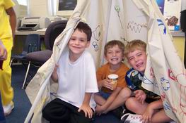 Hanging out with his classmates in the tee pee
