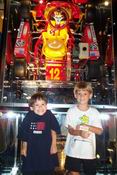 That go cart above them is of an 8-year-old champion
