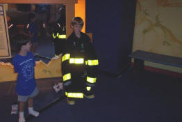 They can try on a firefighter's boots and coat.  They were HEAVY!