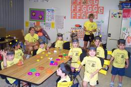 Bees in their classroom waiting to parade outside.