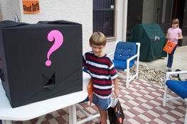 The Mystery Box - you stick your hand in and guess what you're feeling.  But Travis was manning the booth and grabbing the kids' hands from the inside!