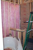 If you use your imagination, the tub is obvious, and behind it is the framing for the bottom wall of the shower (the top will be glass)