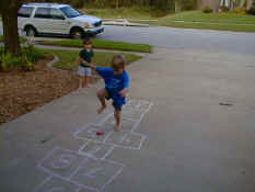 Alex playing hop scotch