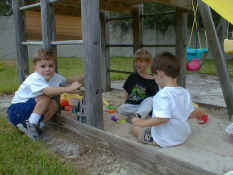 Jacob, Alex and Patch in the sand box