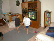 Alex and Patch showing Jacob the tree pose