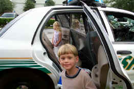 They got to walk through the police car.  The teacher said she didn't ever want to see them in the back of a police car again!
