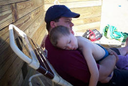 Jonah was all tuckered out (with his daddy, Tim)