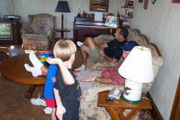 Alex and Patch seeing who could high five Uncle John the hardest
