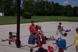 His teacher, Ms. Ronda, is sitting in the blue shirt.  She was amazingly calm and perky for sitting in 100 degree weather!