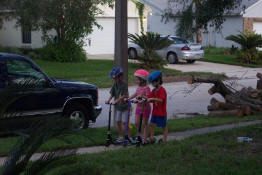Alex, Kori and Patch having scooter races - and no one broke anything!