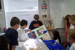 Showing his pictures of the eggs hatching